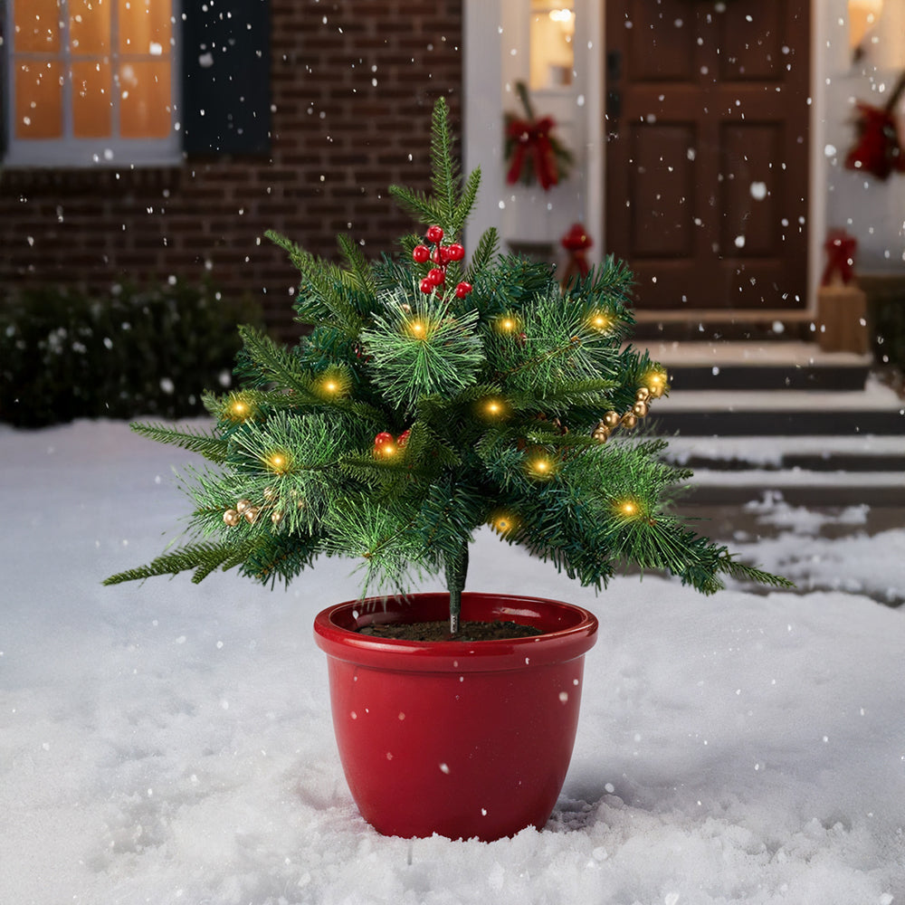 Artificial Christmas tree urn filler decoration with string lights by Garden Sanctuary, featuring festive holiday greenery and glowing lights.