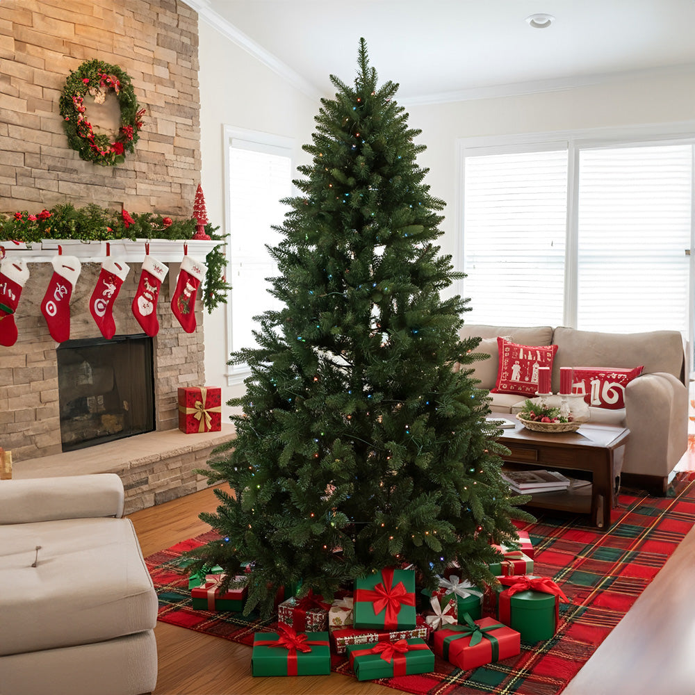 Artificial 4ft Christmas tree with RGB lights and wood stand from Garden Sanctuary, featuring lush green branches and decorative lighting.