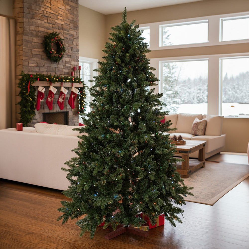 Artificial 4ft Christmas tree with RGB lights and wood stand by Garden Sanctuary, showcasing festive greenery and colorful illumination.