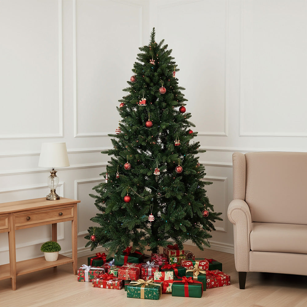 Artificial 4ft Christmas tree with RGB lights and wood stand by Garden Sanctuary, featuring lush green branches and festive decoration.