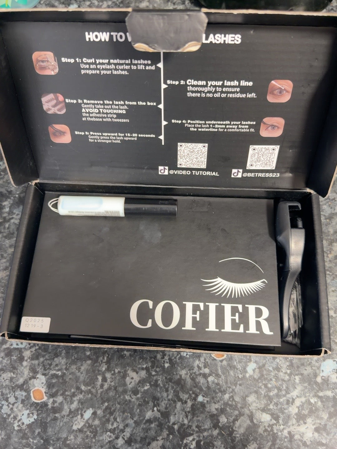 Pre-owned false eyelash kit in opened box with COFIER-labelled inner case and visible accessories